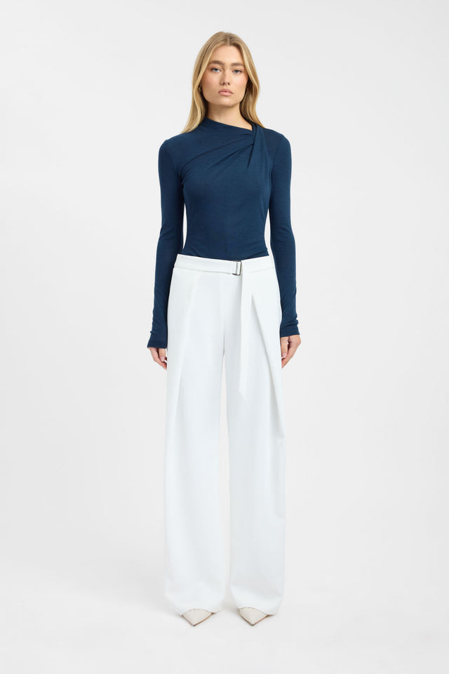 Showcasing the Anna Wool Long Sleeve womens blouse in fitted silhouette with asymmetry neckline and navy full straight sleeves front
