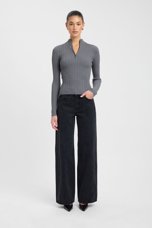 Showcasing the Bristol Zip Top womens blouse in dark grey with fitted silhouette, high-neck design, and full straight sleeves on-body