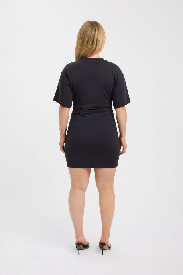 Displaying the Nova Mini Dress in womens dresses with bodycon shape, mini length, fitted silhouette, round neckline and black color back