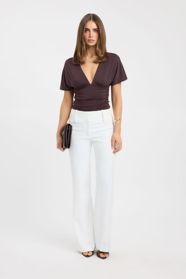Showcasing the Isla Top womens blouse in brown with fitted v-neck and short sleeves front