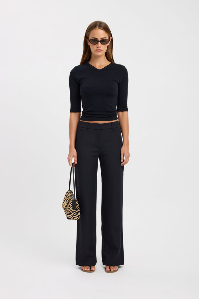Showcasing the Ariel Low Rise Pant Petite in womens regular pants with wide leg styling and black colour front