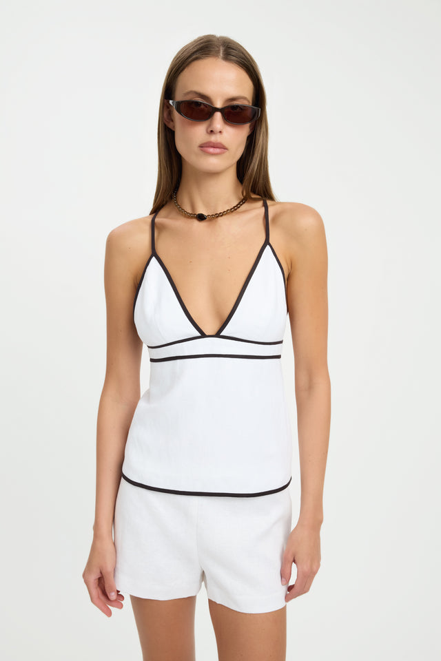 Showcasing the Ios Contrast Piping Top womens blouse in white with black featuring fitted v-neck sleeveless styling front