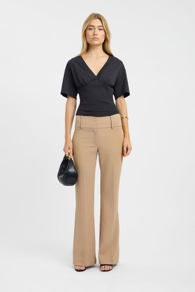 Discover the Levi Tee womens blouse in black with fitted silhouette and v-neck on-body