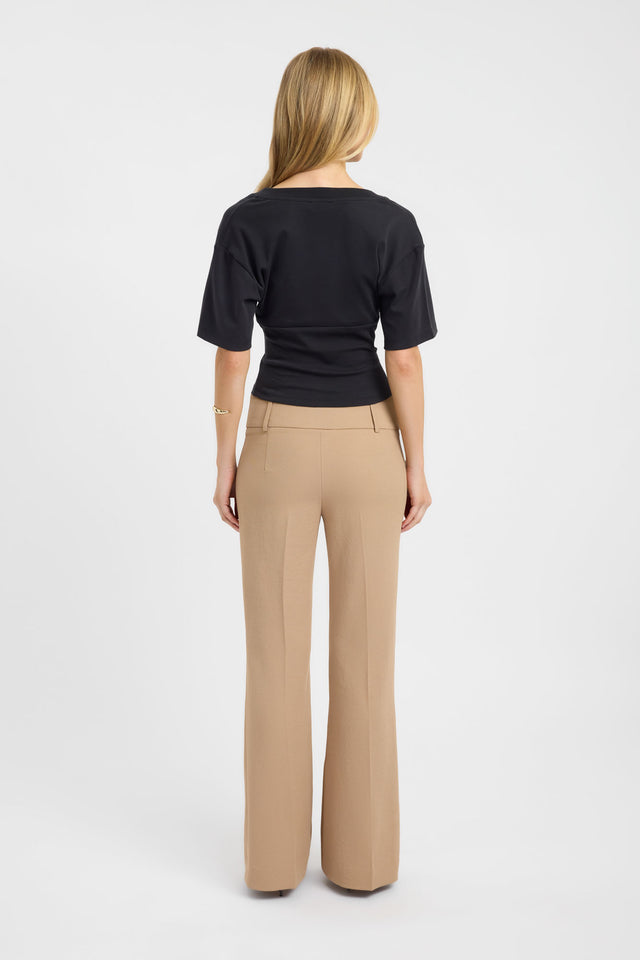 Explore the Levi Tee womens blouse in black with fitted short silhouette back