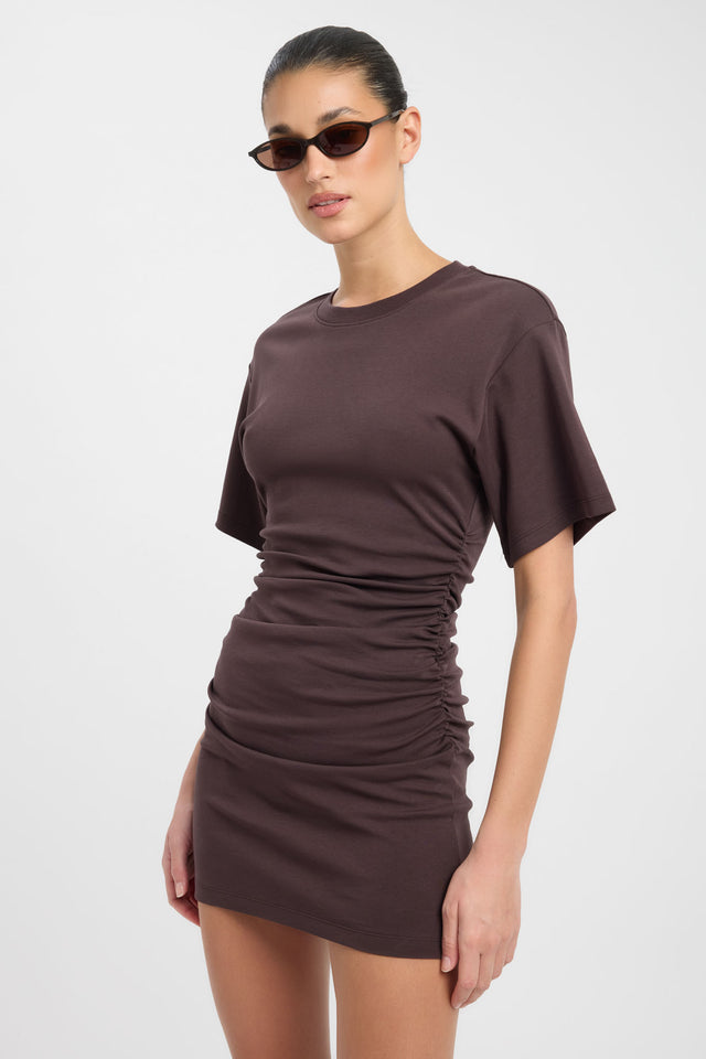 Featuring the Nova Mini Dress in bodycon mini length with fitted shape and rosy brown hue side