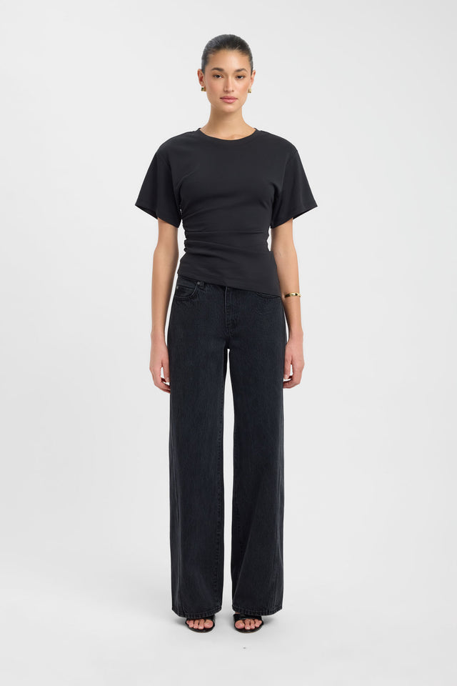 Showcasing the Nova Tee womens blouse in fitted black silhouette with round neckline and short sleeves front