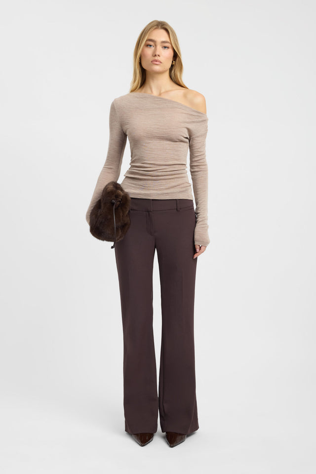 Showcasing the Whistler Wool Top womens blouse in tan with fitted silhouette, asymmetric neckline and full straight sleeves on-body