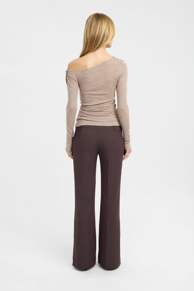 Crafted from wool, the Whistler Top womens blouse in tan with fitted style, asymmetric neckline and full straight sleeves back