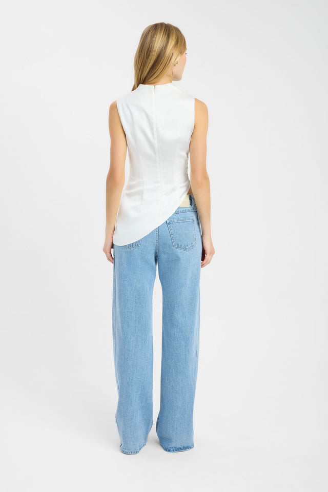 Showcasing Palermo High Neck Top womens-blouse in ivory with fitted silhouette and sleeveless cut side