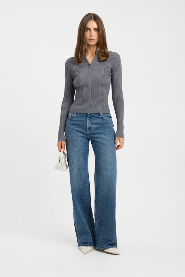 Showcasing the Bristol Zip Top womens blouse in dark grey with fitted silhouette, high-neck design, and full straight sleeves on-body