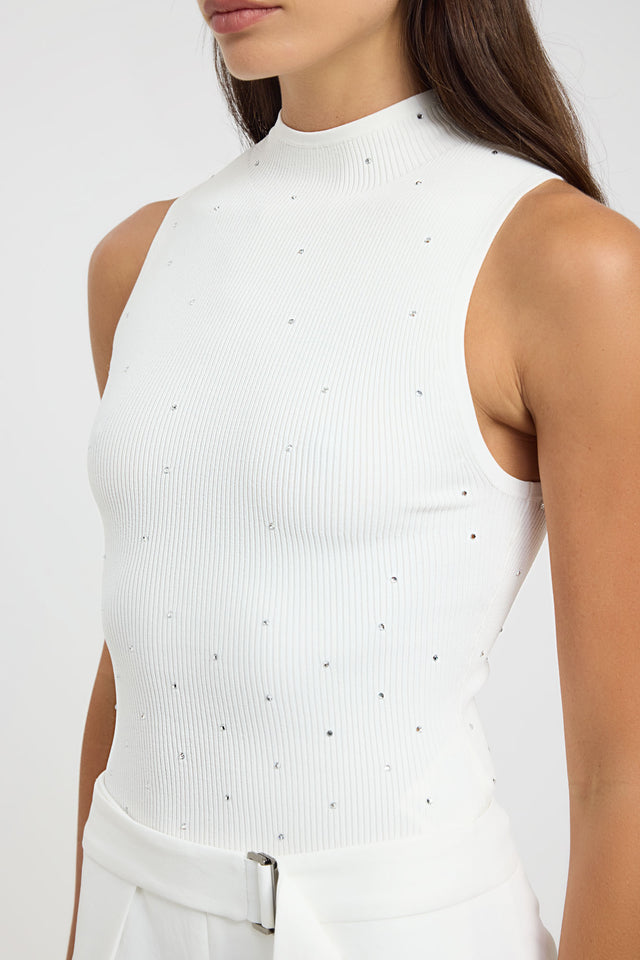 Showcasing the Riviera Tank womens-blouse in white fitted high-neck sleeveless with silver embellishments detail